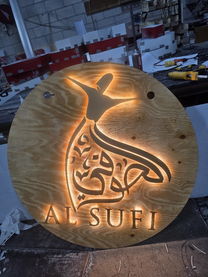 Backlit Lobby Sign on Wood